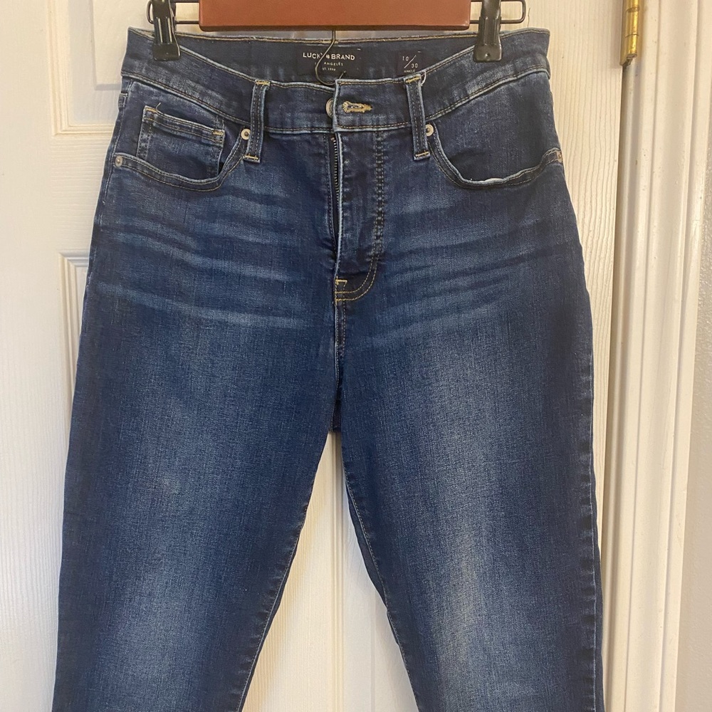 Lucky Brand size 30. Dark wash. Skinny jean. Button up